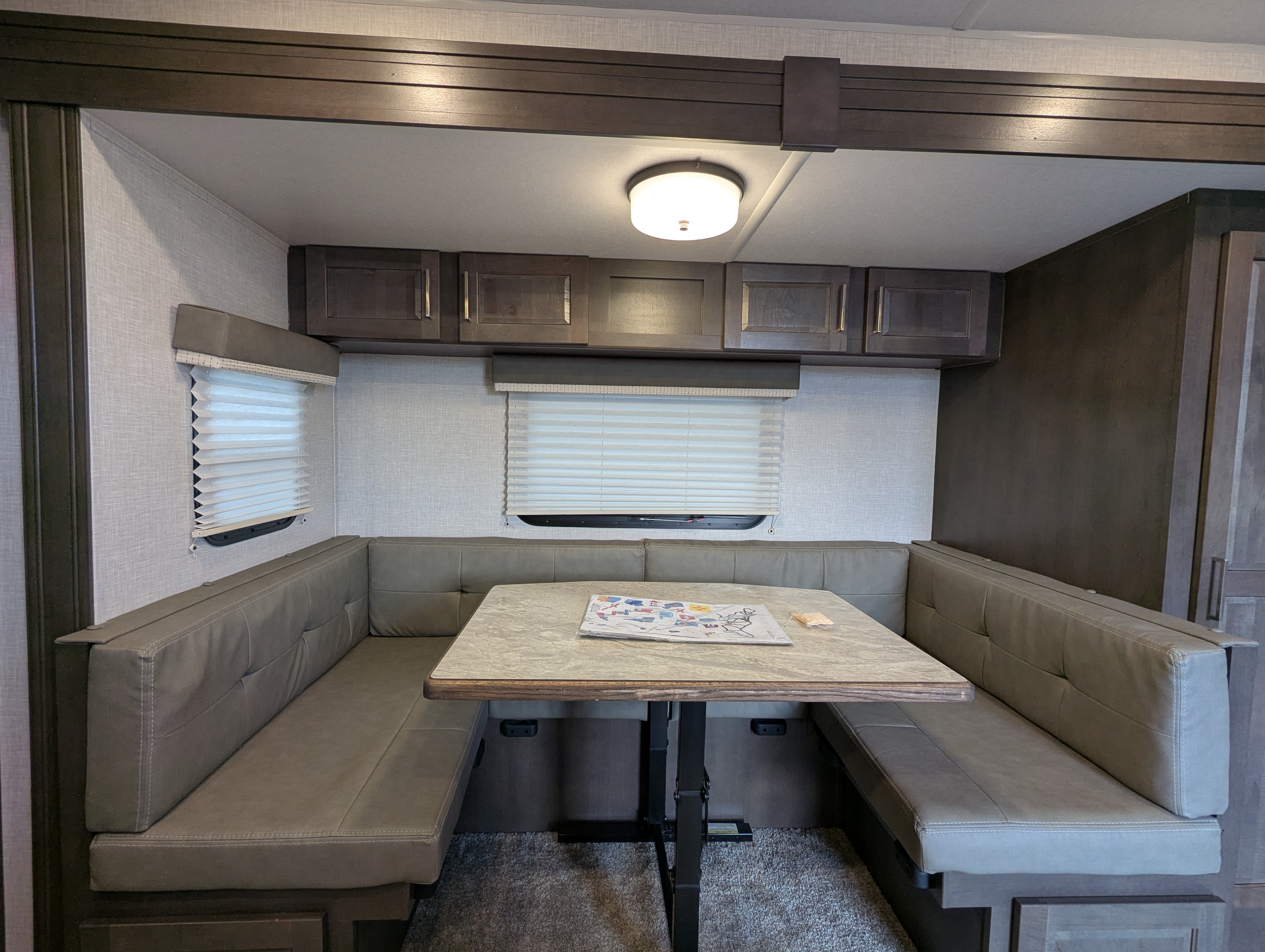 U-shaped dinette booth with overhead cabinets