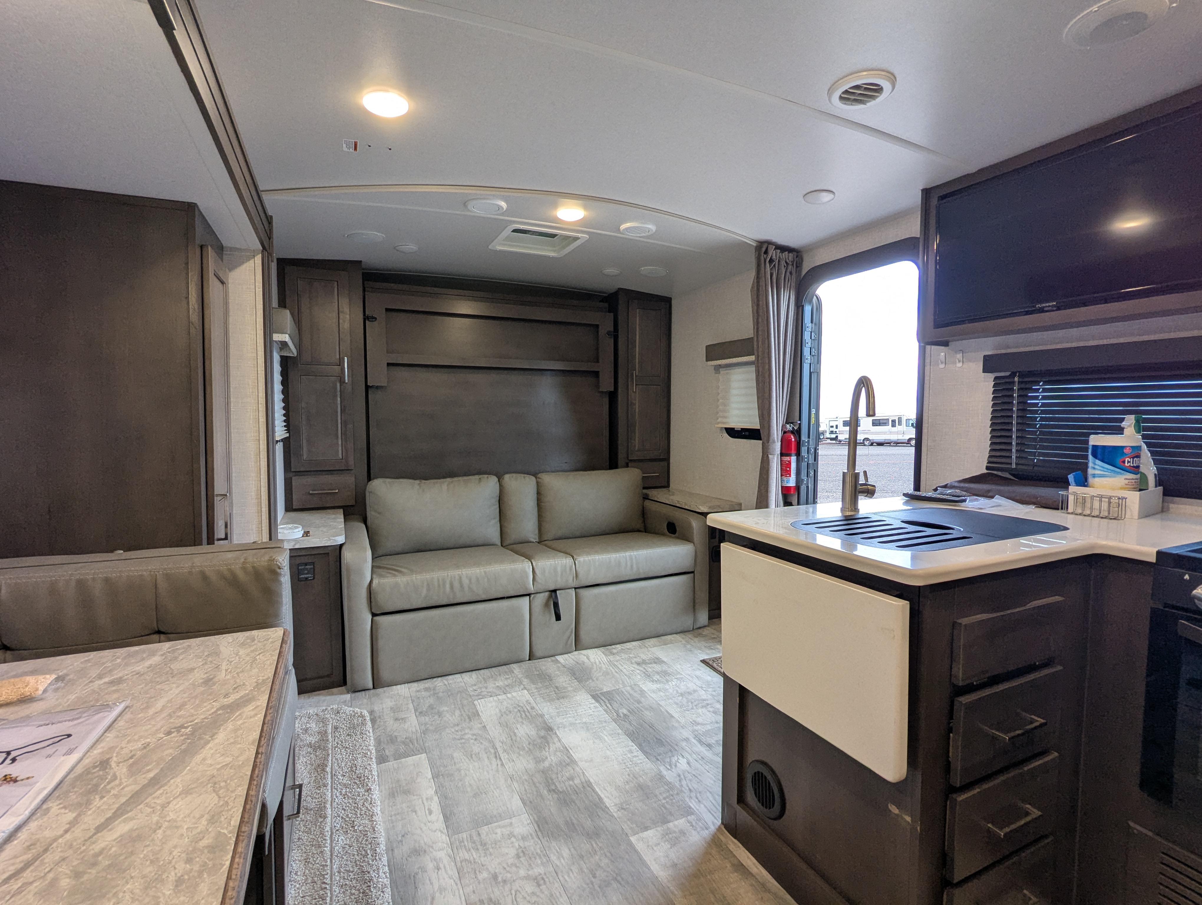 Interior view from dinette toward Murphy bed and kitchen