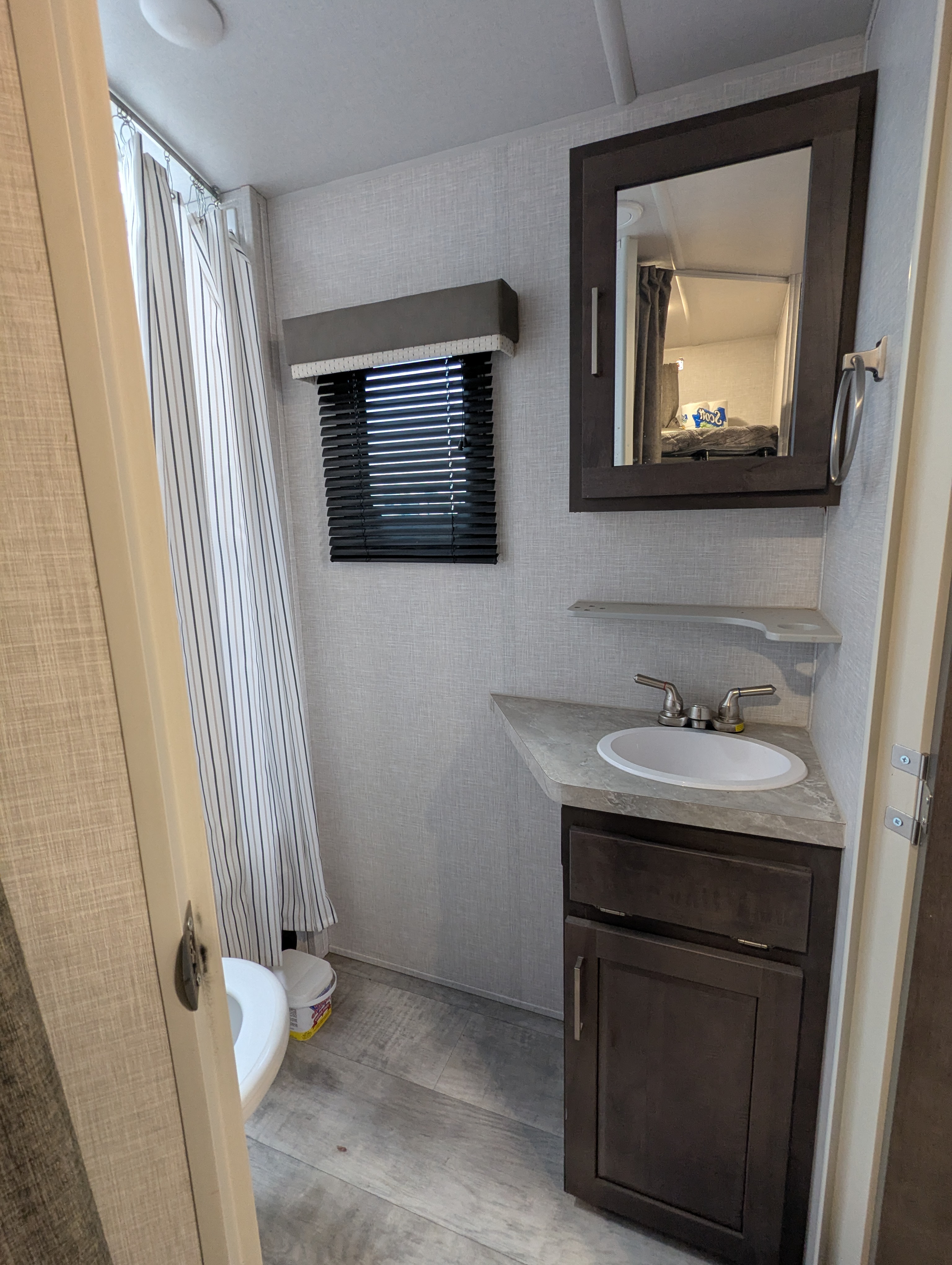 Bathroom — vanity, mirror, and shower curtain