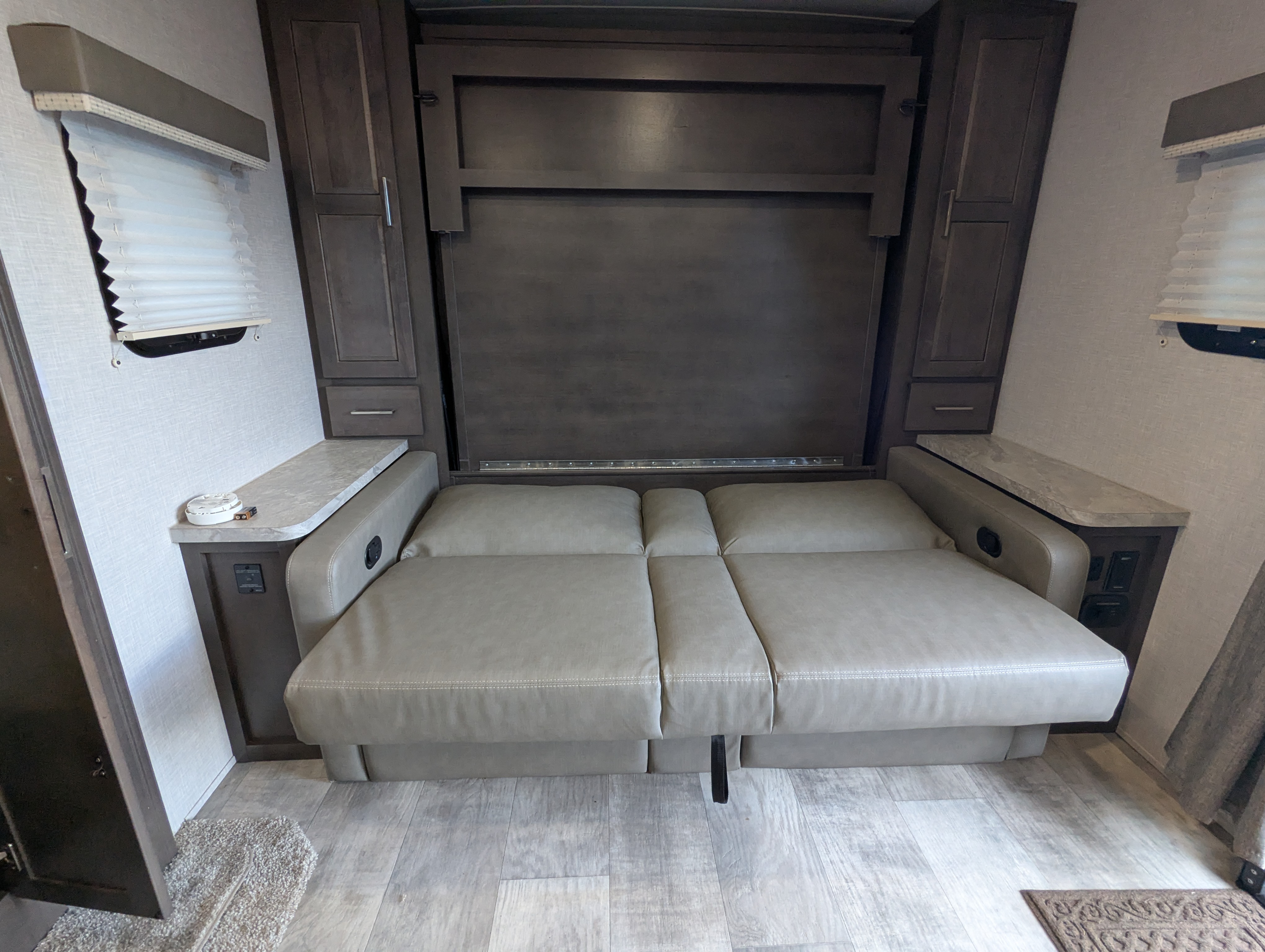 Murphy bed folded down with theater seating