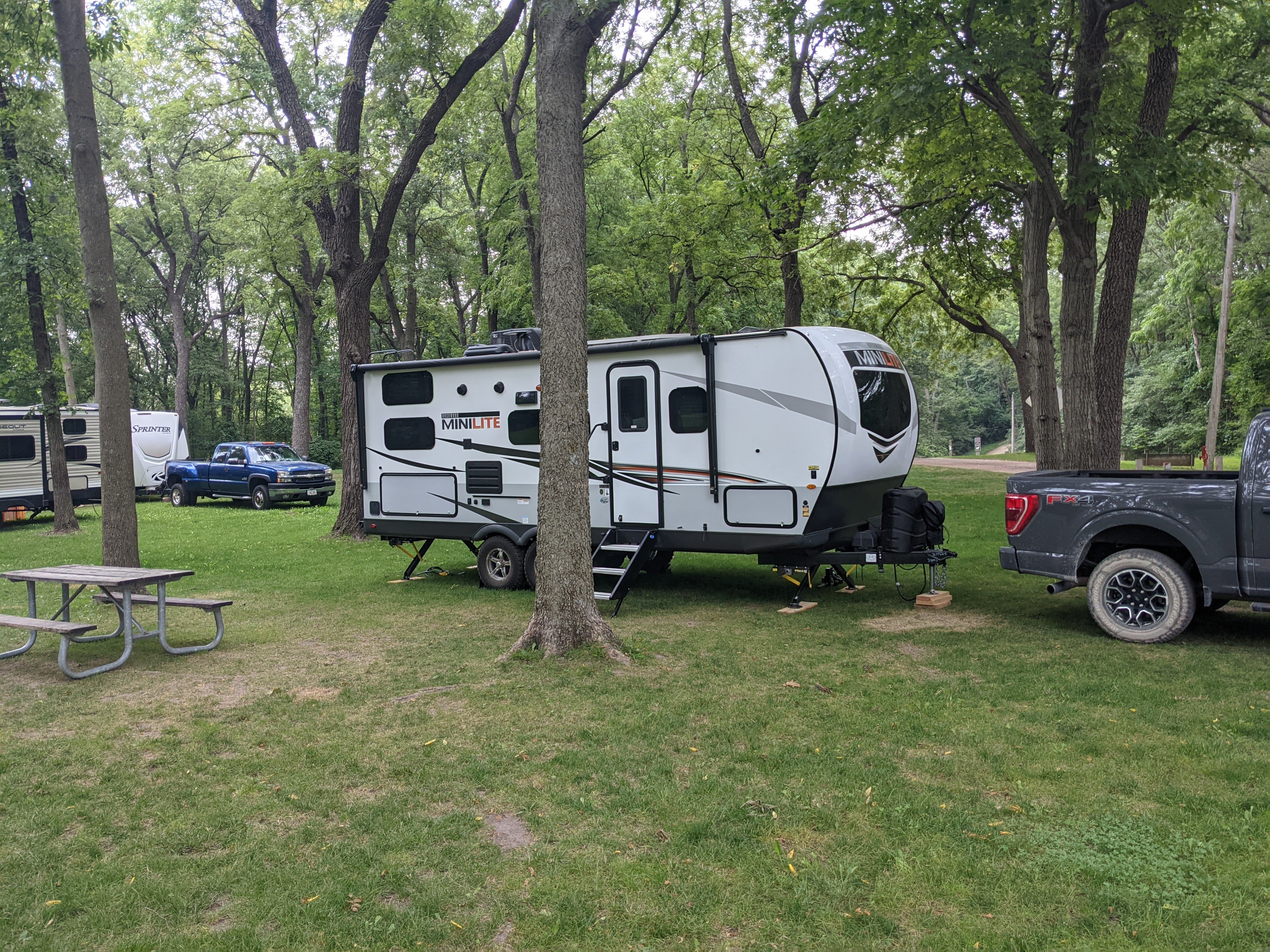 Camper at campsite with picnic table